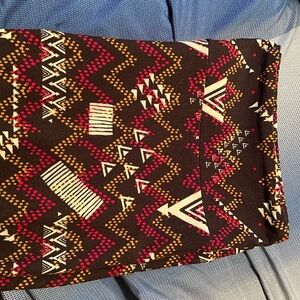 LuLaRoe Tall and Curvy leggings black w/red, light green and brown pattern